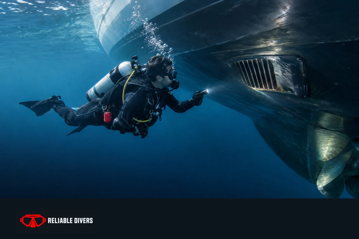 Illustrative diver checking the underwater hull and intake of a yacht